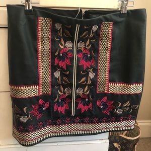 Black leather mini skirt with embroidery